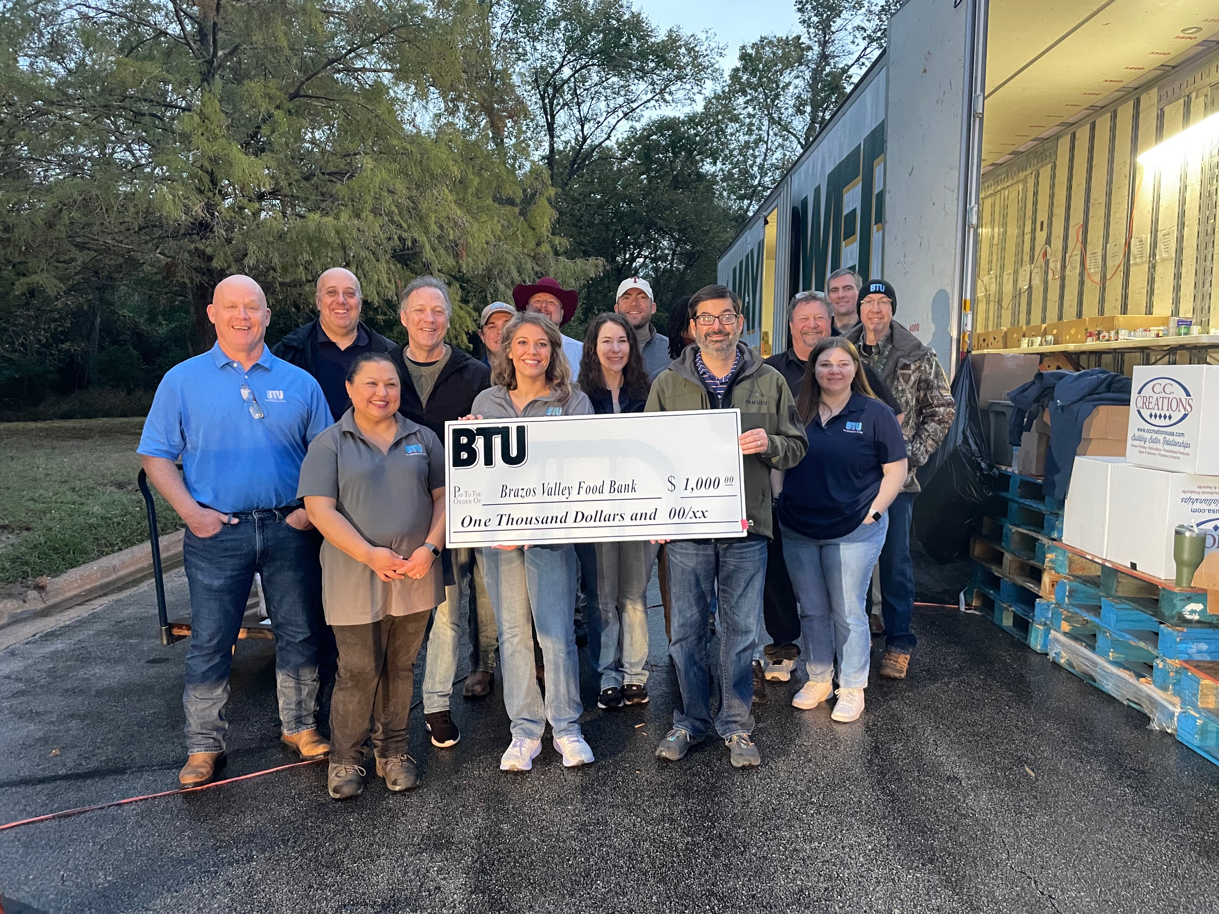 BTU Staff presenting the Brazos Valley Food Bank with a donation