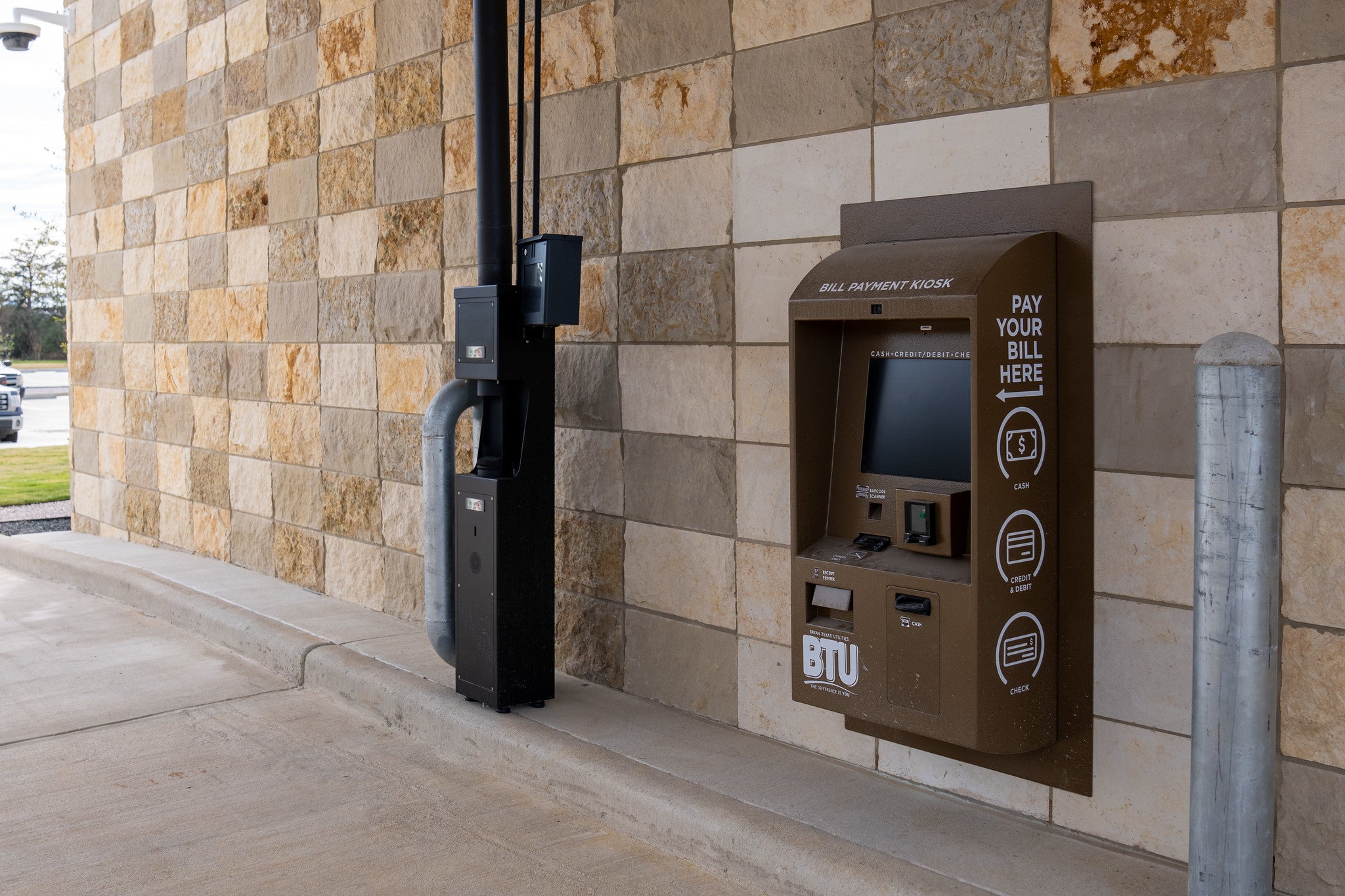 A BTU bill pay kiosk at the drive through of the BTU administration building