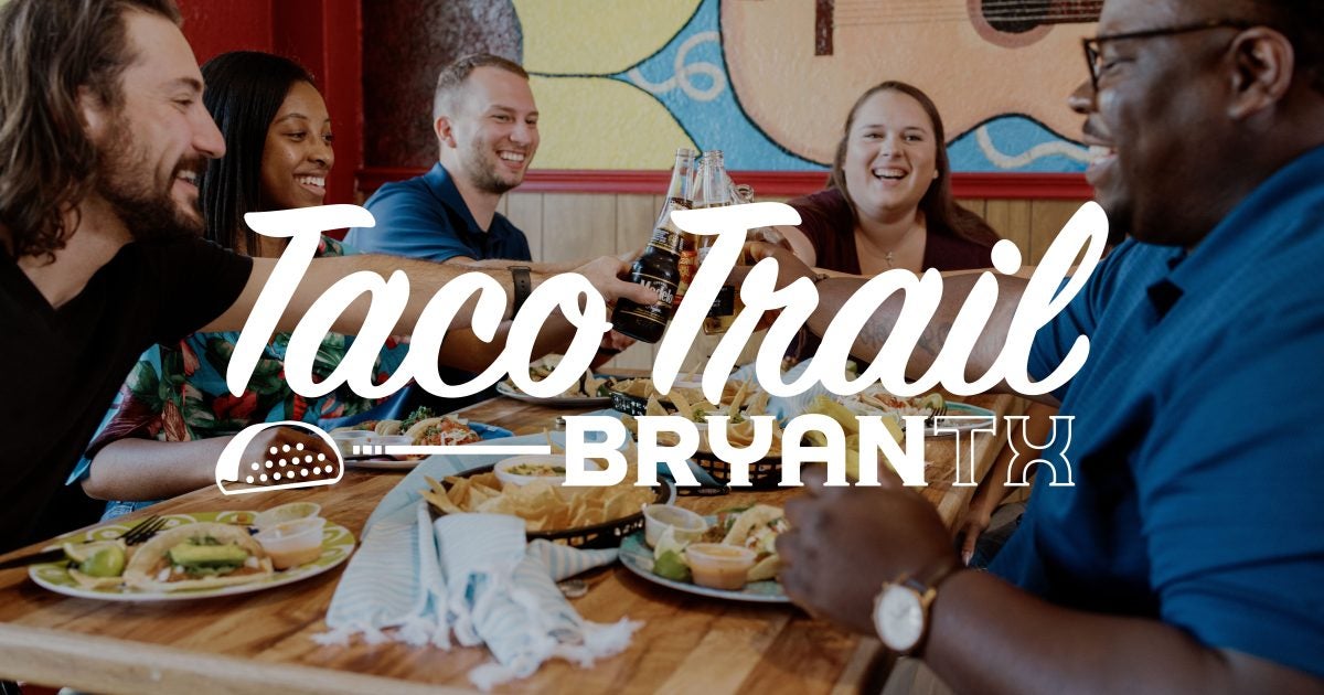 a group gathers to enjoy a meal of delicious tacos on the Bryan Taco Trail